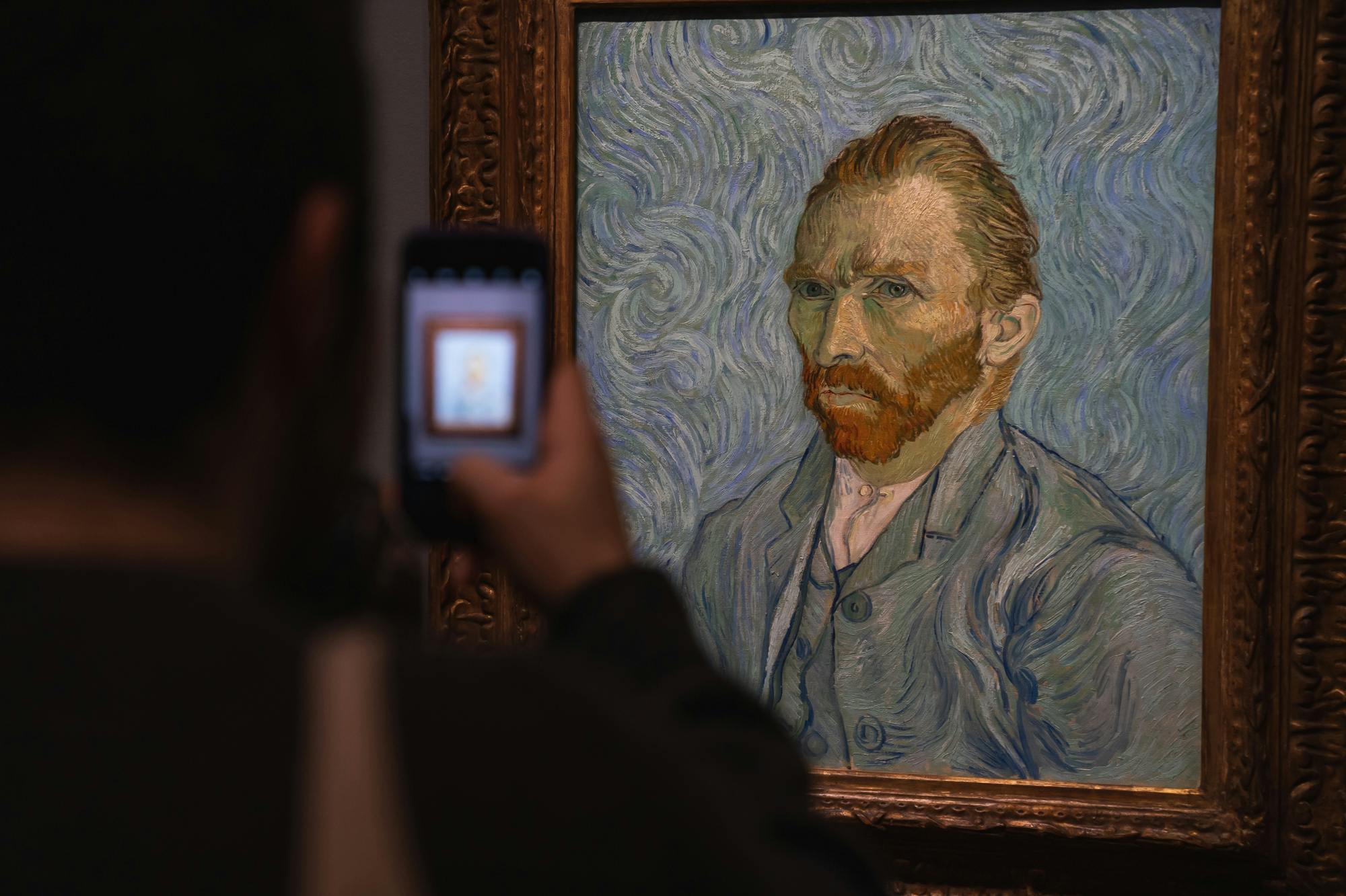 Someone taking a photo of Vincent van Gogh&#39;s self-portrait at the Musée d&#39;Orsay