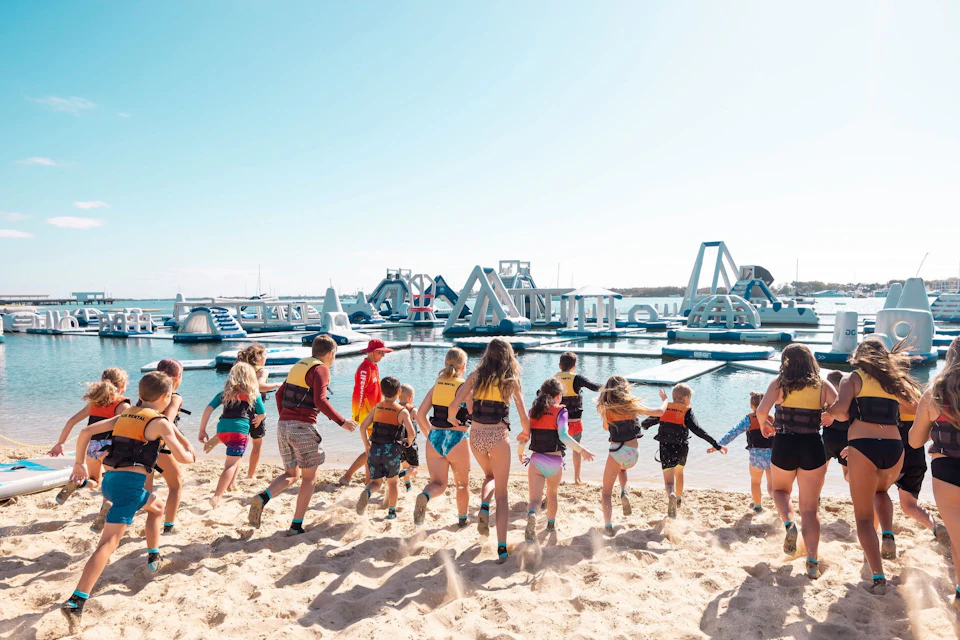 Kids excitedly running to the Aqua Park