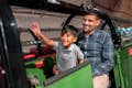 A father and son riding Mail Rail at The Postal Museum