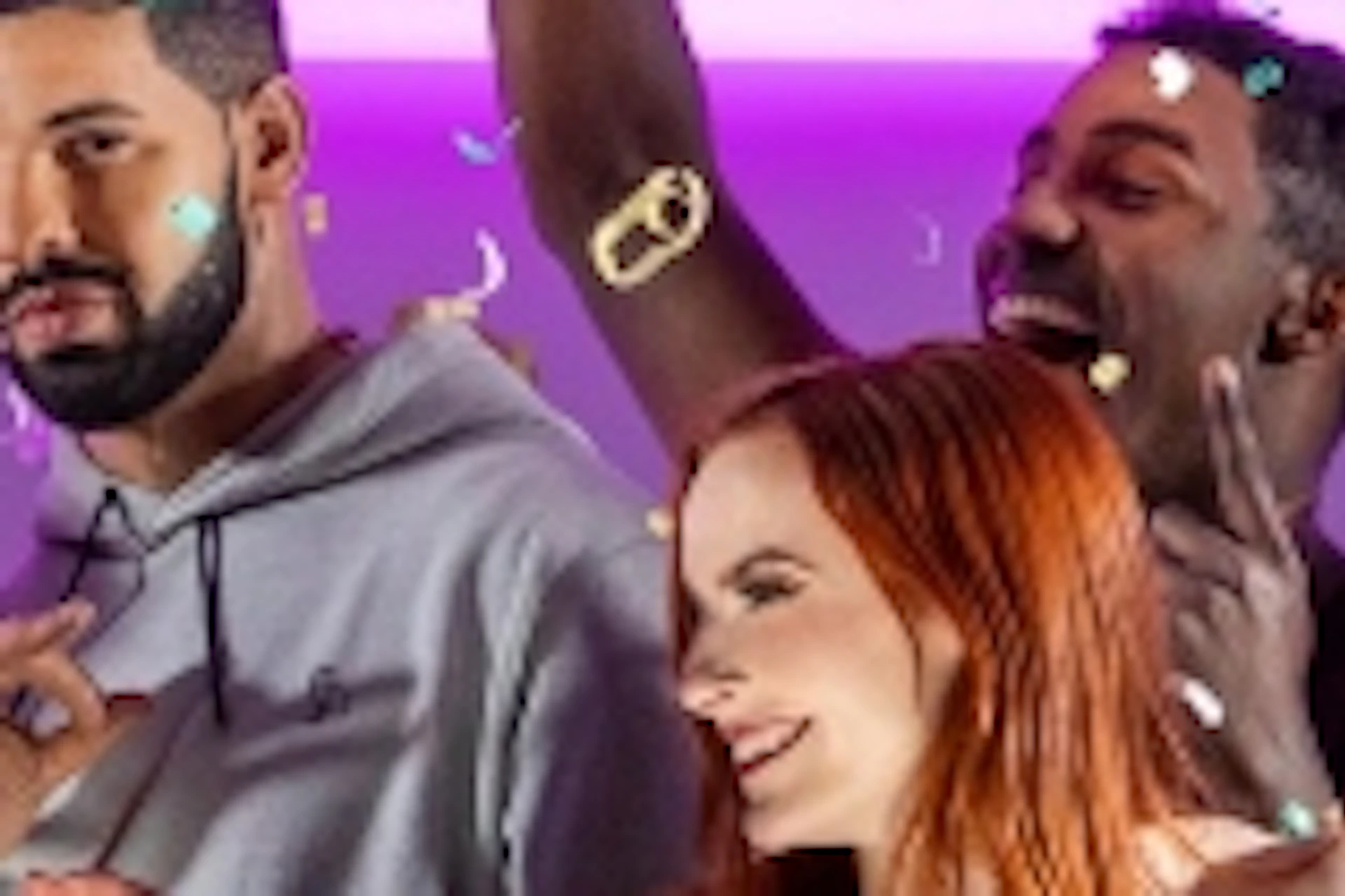 A group of six people partying with confetti against a pink and purple lit background, smiling and dancing.