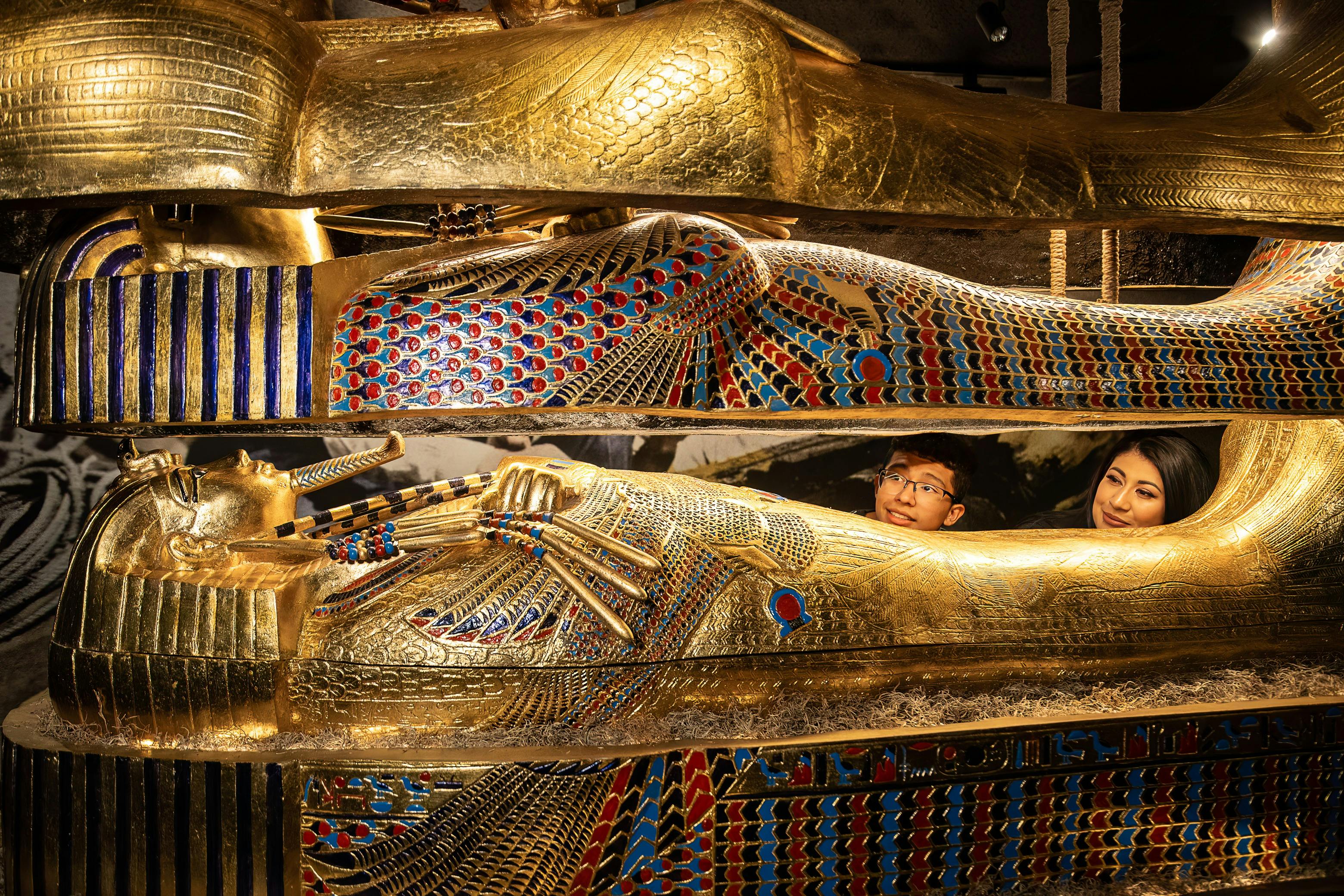Visitors looking at a tomb at the Discovering King Tut's Tomb exhibition in Las vegas