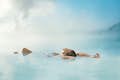 Woman floating in the Blue Lagoon 