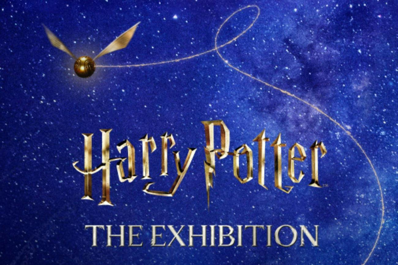 Golden snitch and text 'Harry Potter The Exhibition' on a starry blue background.