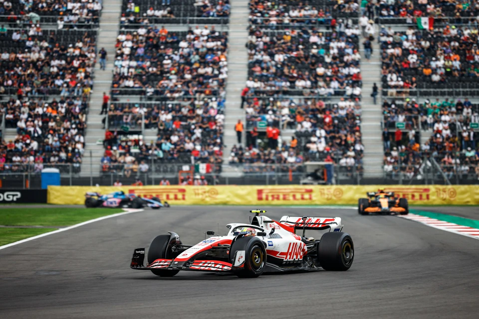 F1 team Haas entering a turn in the Mexican Grand Prix