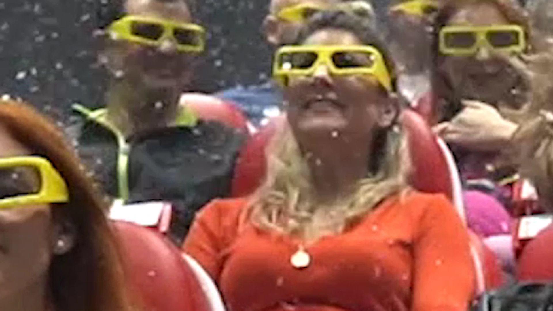 People wearing 3D glasses experience a 4D cinema with effects like snow and moving seats.