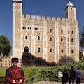 A Beefeater stands guard of the Tower of London