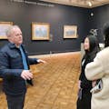 Guide discussing Monet's London paintings
