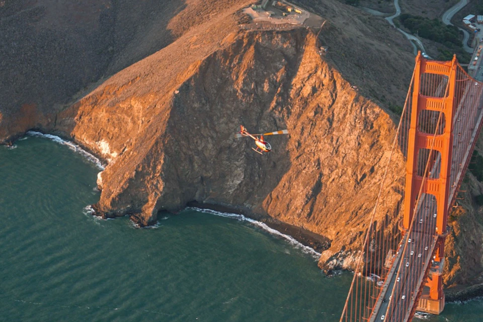 Helicopter up close to Golden Gate Bridge