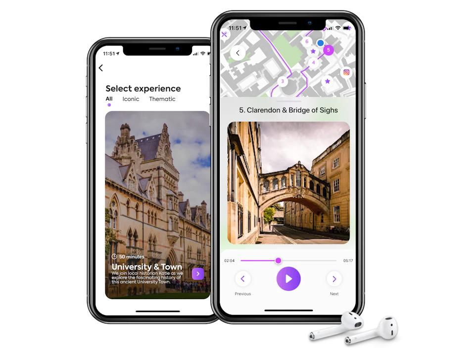 Two smartphones display a travel app with tour options and maps, next to wireless earbuds.