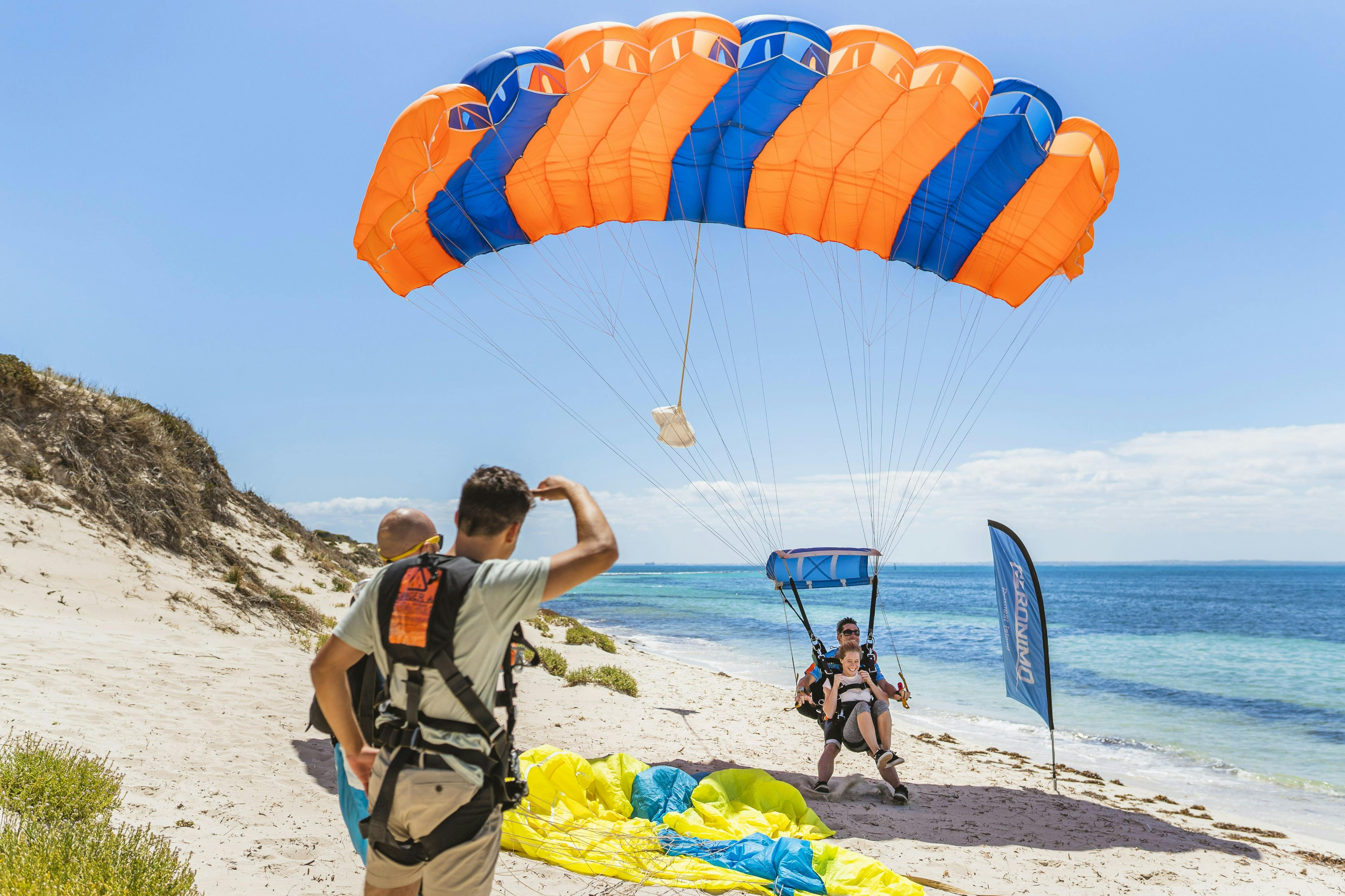 Tandem skydive pair landing on Rottnest Island beach