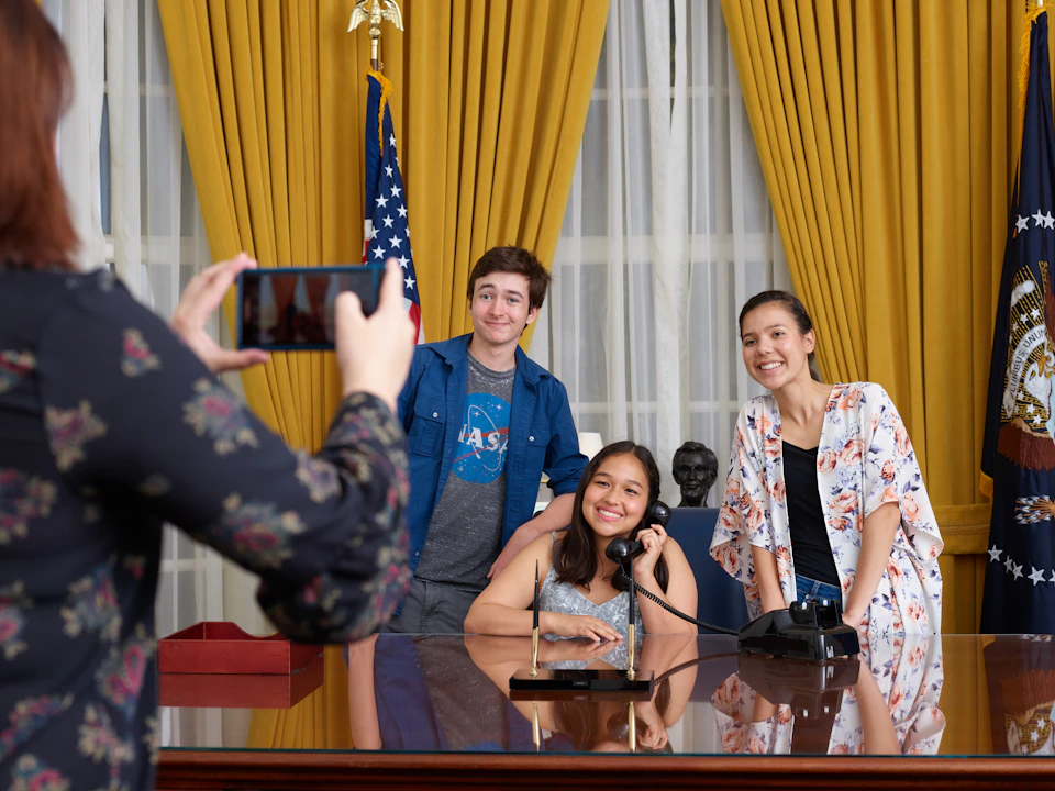 Take a photo behind the president’s desk! The Oval Office is designed in the original 1969 decor of California blue and gold.