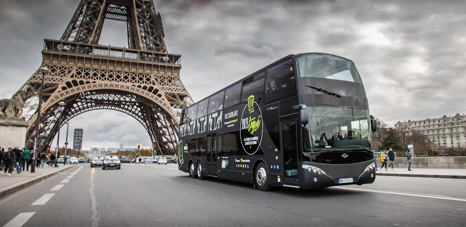 The Bus Toqué Champs-Elysées crosses the Pont d'Iéna