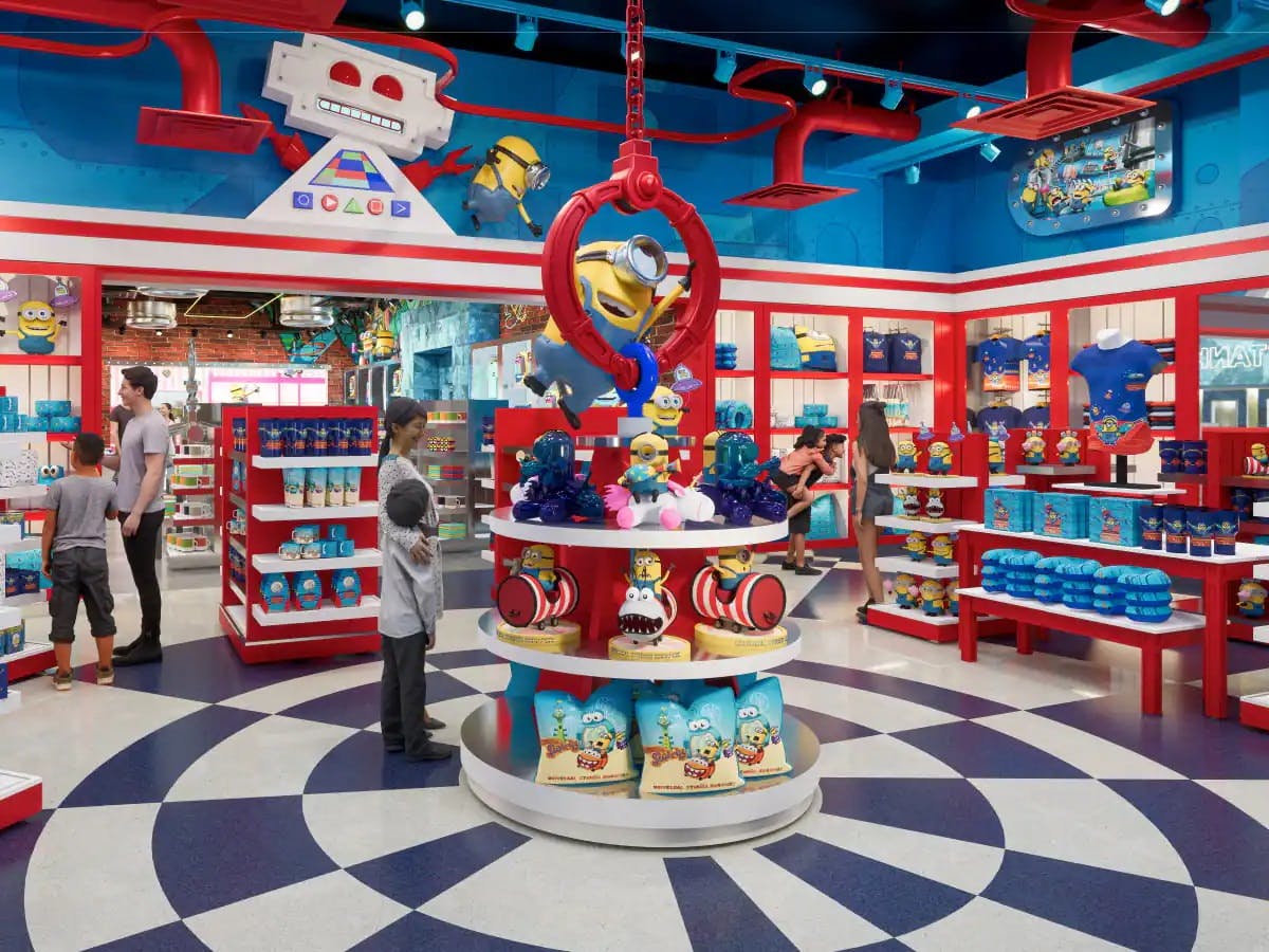 Pestrobarevný obchod s hračkami se zbožím Mimoni, policemi plnými plyšových hraček a produkty pro prohlížení lidmi.