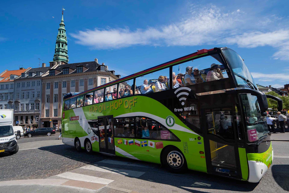 Hop On-Hop Off bus driving through Copenhagen.