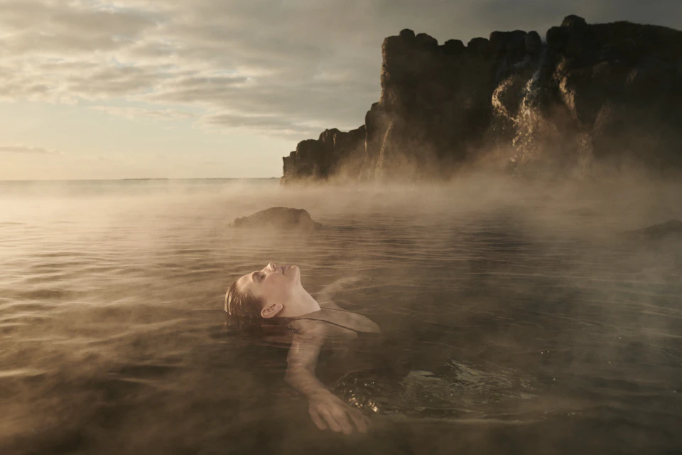 Woman bathing in the Sky Lagoon