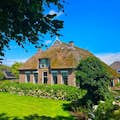 Discover hidden local homes in Giethoorn during our walking tour.