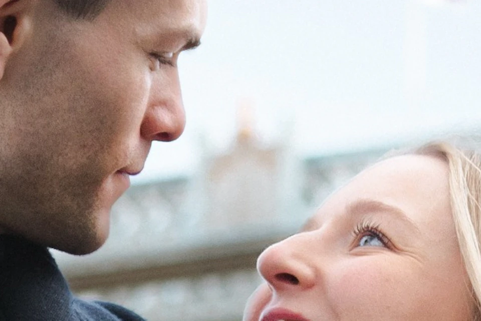 A couple enjoying their photoshoot in front of the iconic Tower Bridge