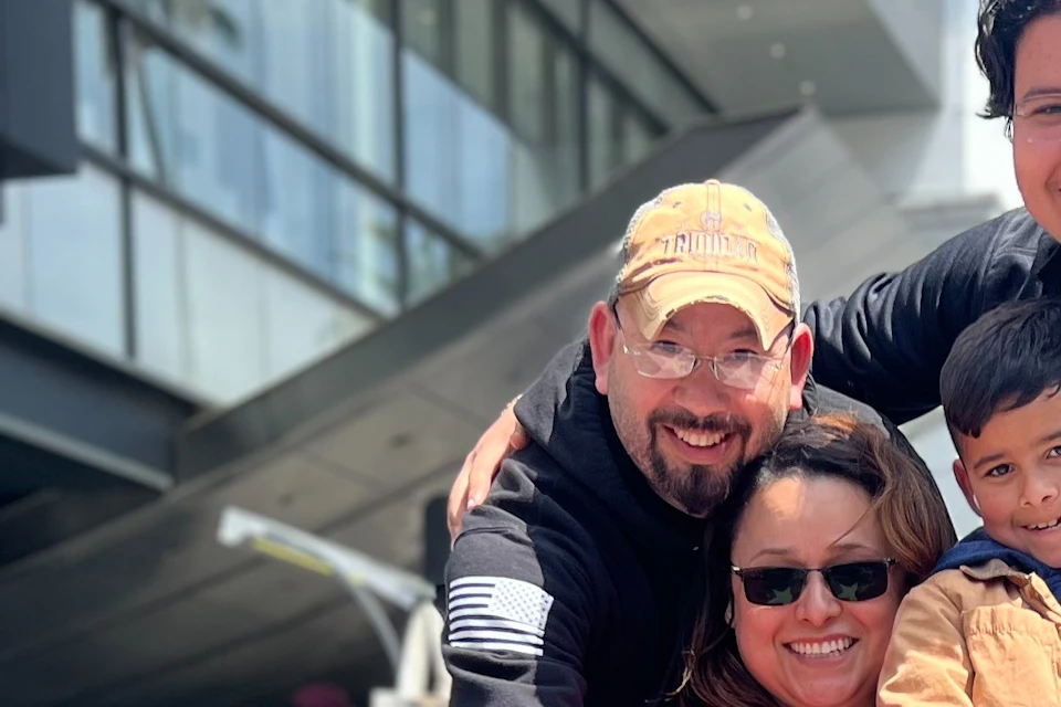 A Hollywood Walk of Fame area Tourist is happy with their own replica star personalized for a photo.#family