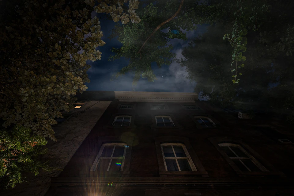 Nighttime photo of the House of Death in New York with a spooky clouds overhead