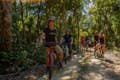 Group in the jungle by bicycle