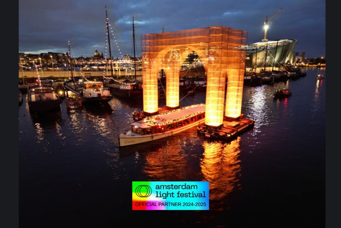 Image of boat on canal cruise going through Amsterdam Light Festival