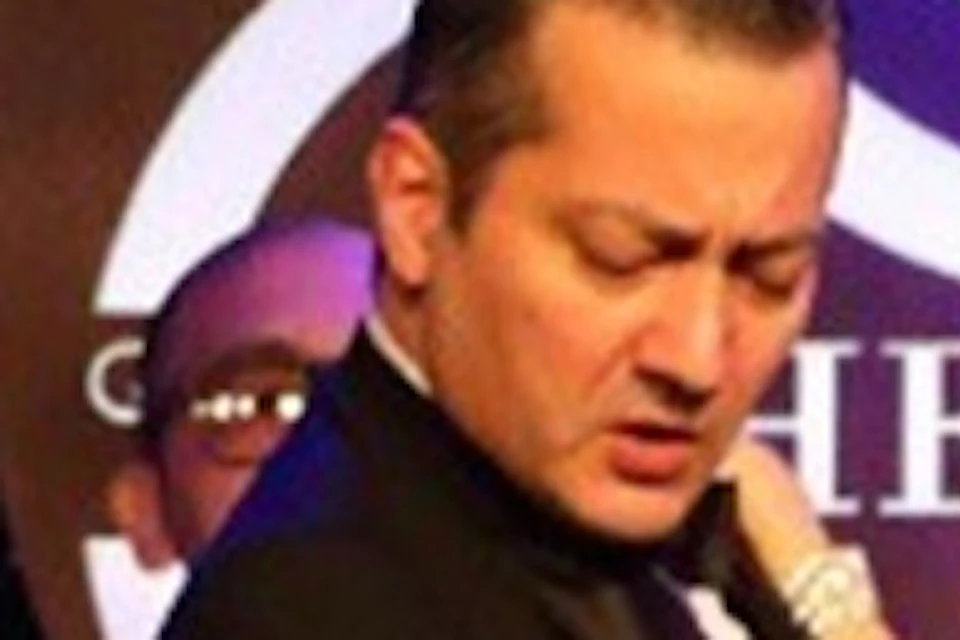 A tango couple moves in perfect harmony on stage, as musicians fill the air with vibrant melodies, creating magic.