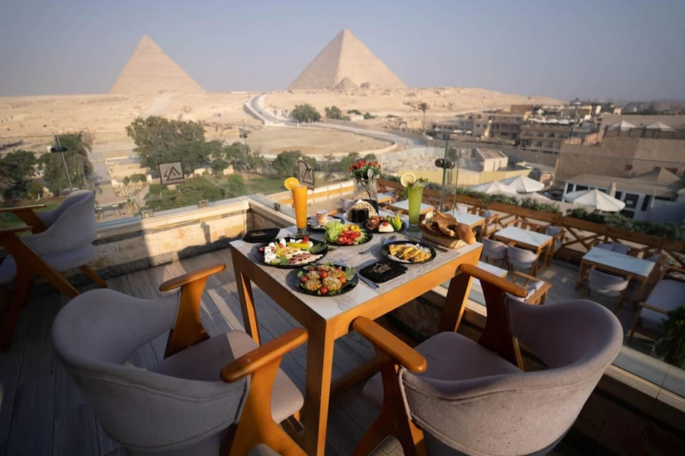 Dine at The Great Pyramid Inn with Pyramid views, a tasty meal, the Sound and Light Show, and hotel transfers included.