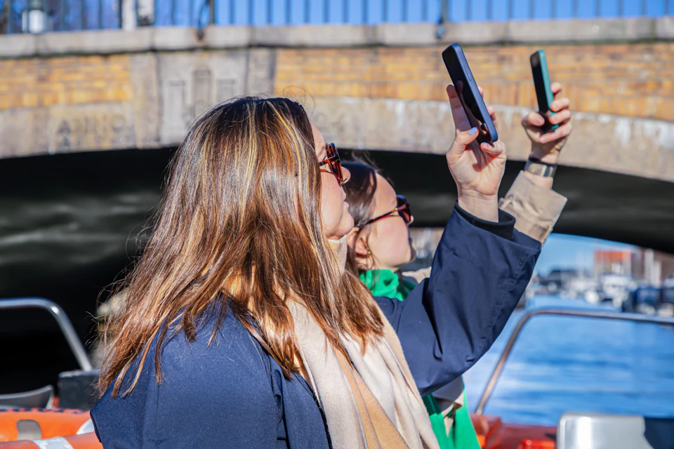 Guests aboard the Classic Canal Tour taking pictures