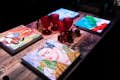 Artistic table projections at the Seven Paintings immersive dining show