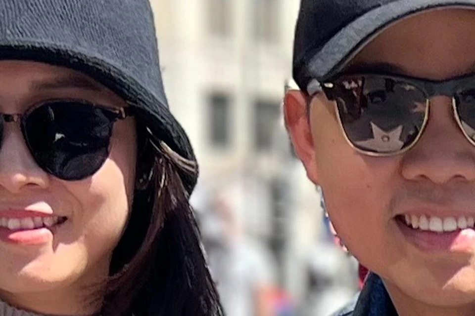 A Hollywood Walk of Fame area Tourist is happy with your own replica star personalized for a photo.#couple