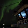 Boat under northern lights