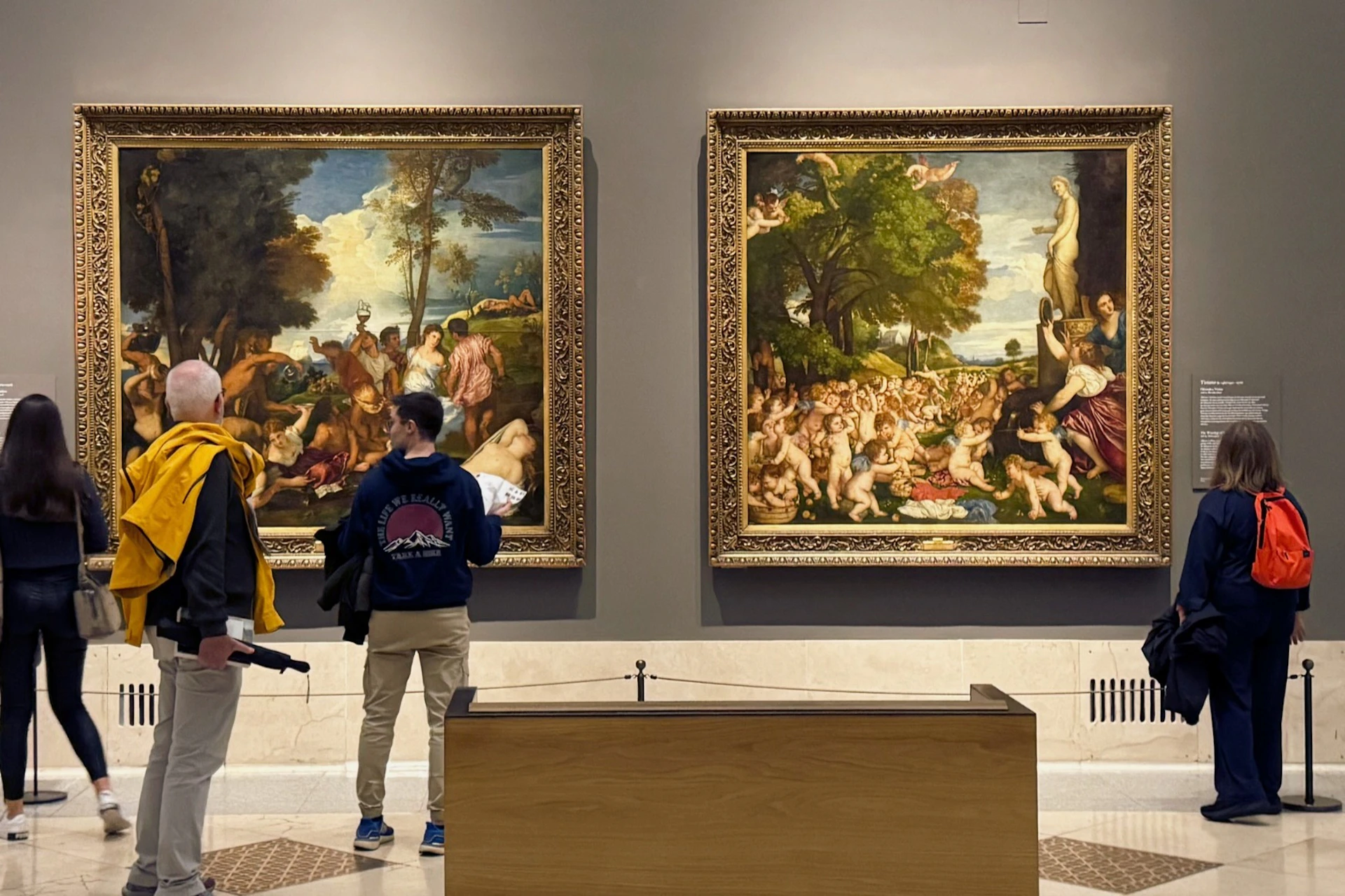 Visitors admiring Venetian Renaissance masterpieces inside the Prado Museum