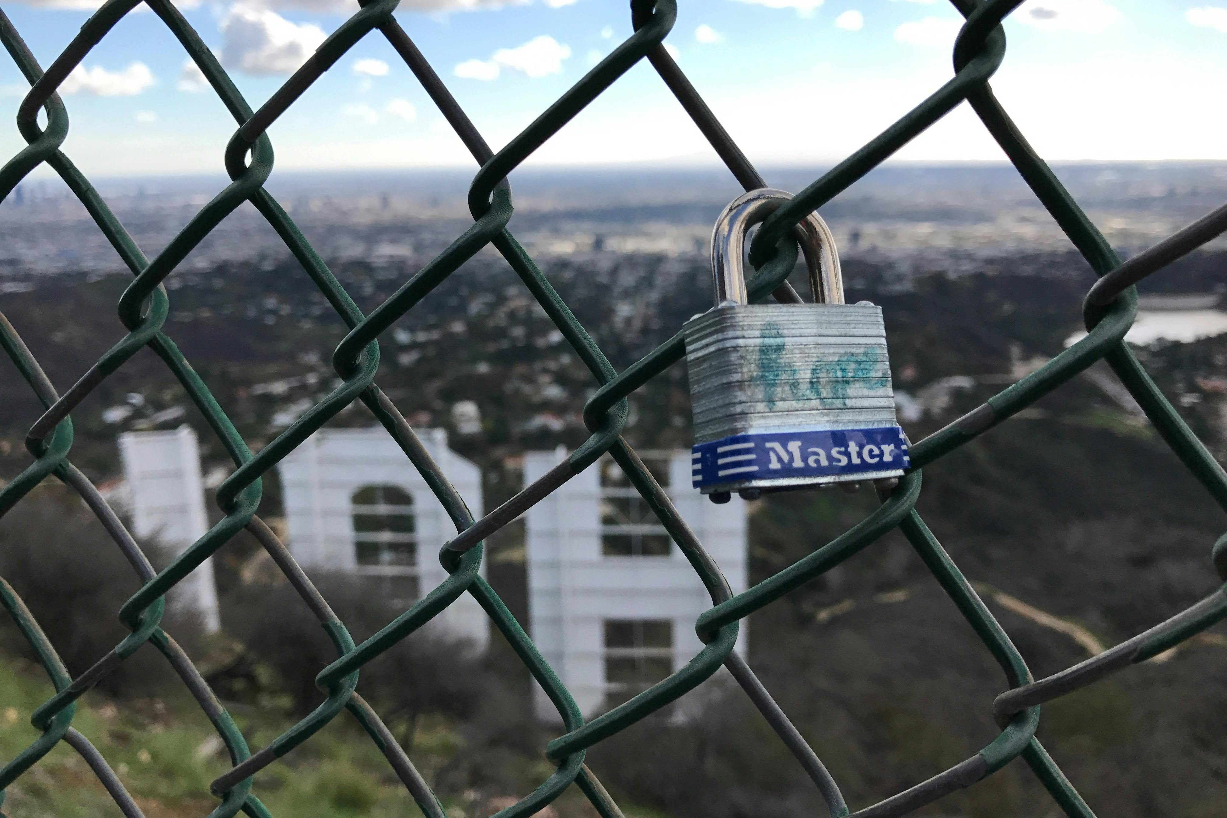 Express your love with a lock on the fence behind the Hollywood Sign