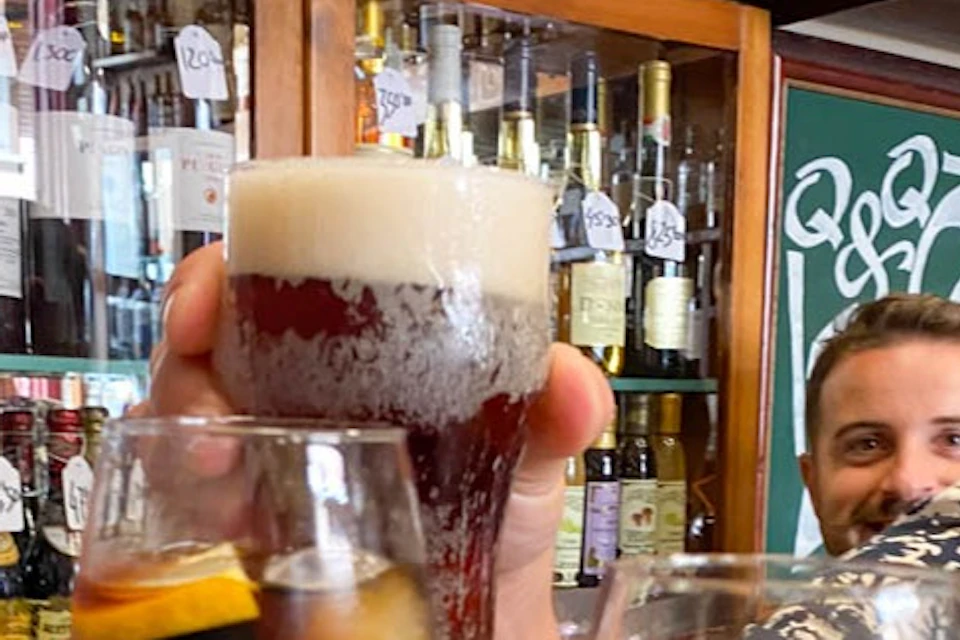 Tasting local drinks such as vermouth or beer.