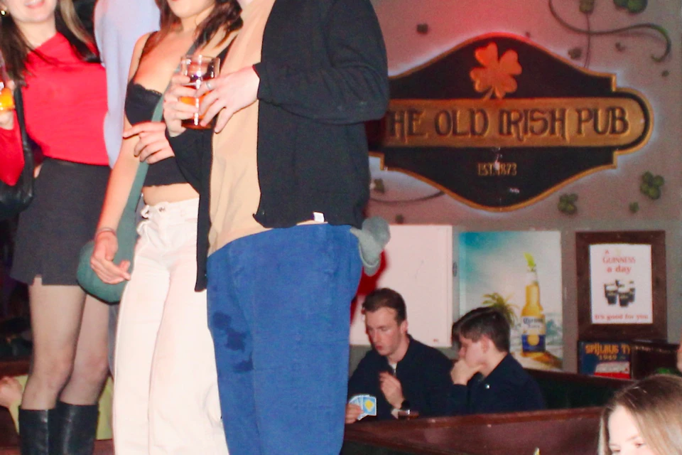Pub crawlers dancing on tables