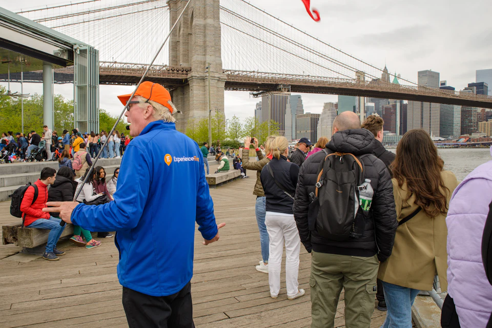 Guide leading group in Brooklyn, Bronx, Queens Bus Tour