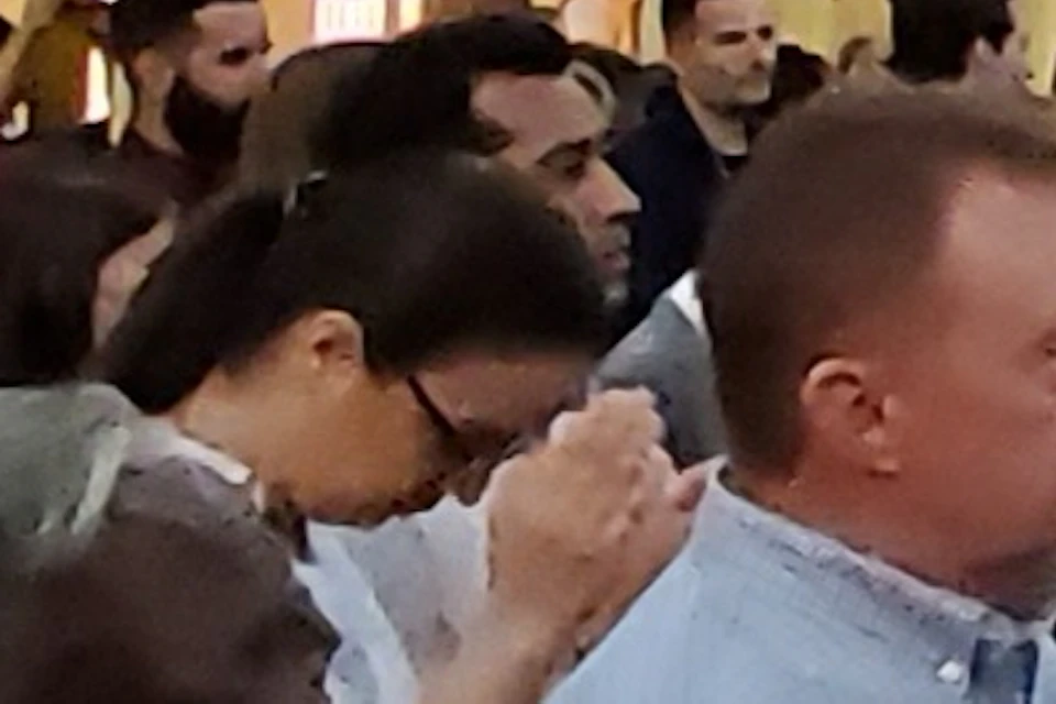 A snapshot of a tour guest immersed in the uplifting atmosphere of a Sunday church service.