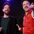 Alumni of Boom Chicago and star of Ted Lasso Jason Sudeikis onstage with the Boom cast