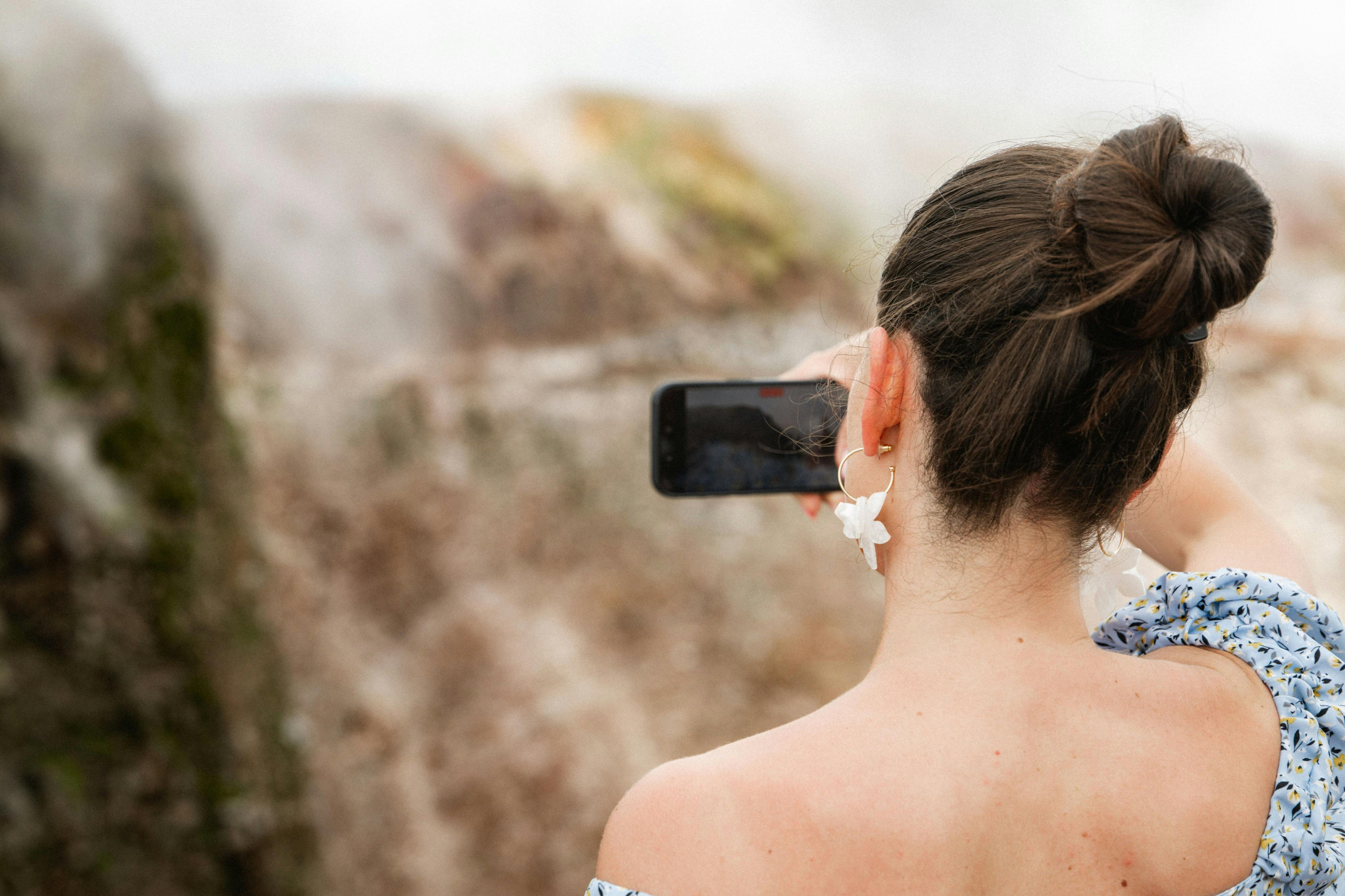 Tourist takes photos of the crater.