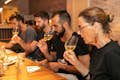 Guests savoring wine during the Kamikaze food tour, enjoying a gourmet tasting experience