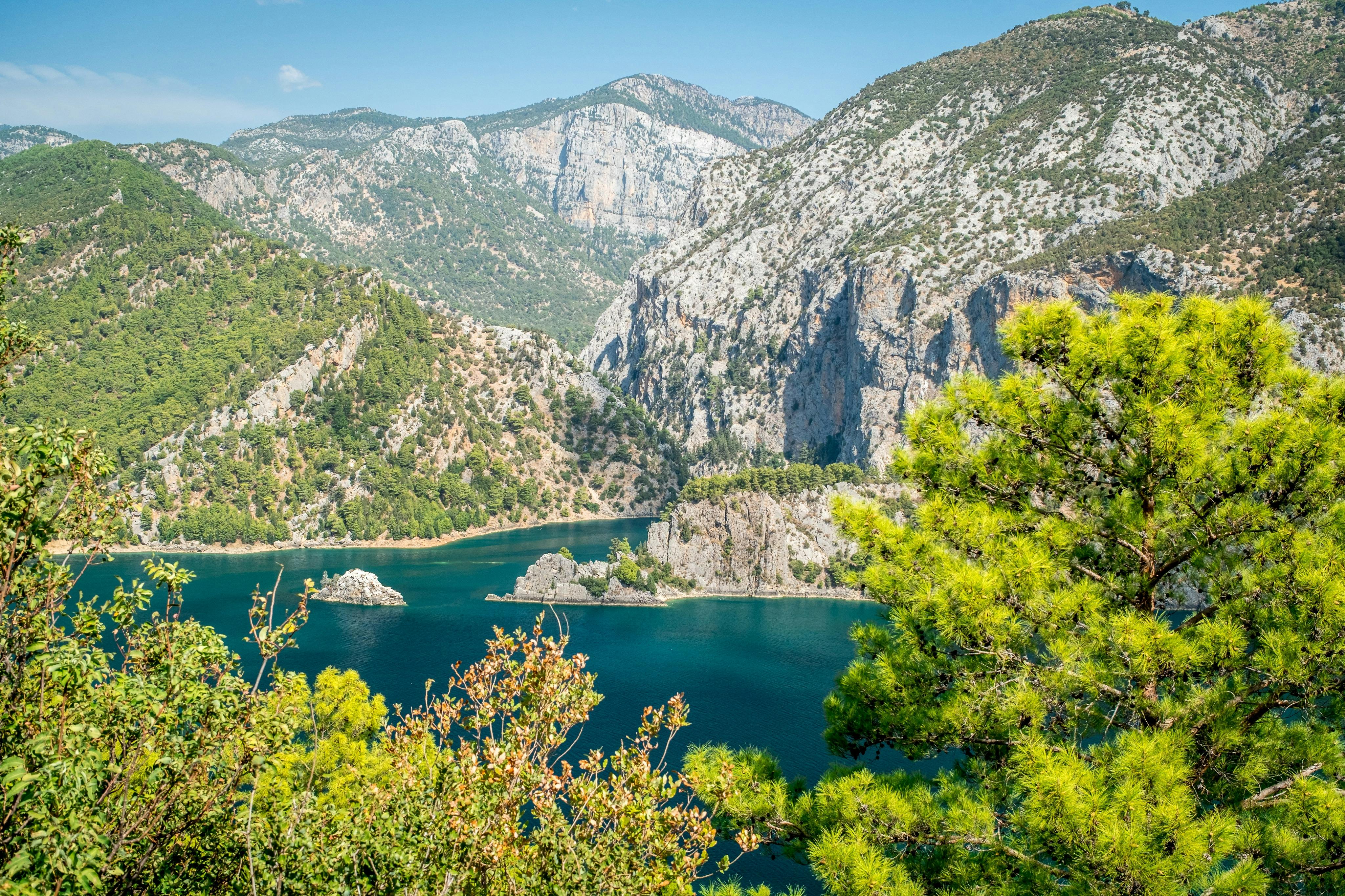 Dam lake in Green Canyon. Beatiful View to Taurus Mountains and turquoise water. Coniferous forest with bright green pine tre
