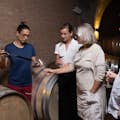 Cellar master draws barrel samples for guests