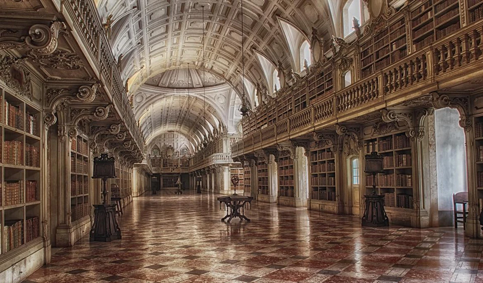 A grand, ornate library with arched ceilings, tall bookcases, and checkered floors.