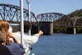 Tour boat sailing towards Hawkesbury River railway bridge