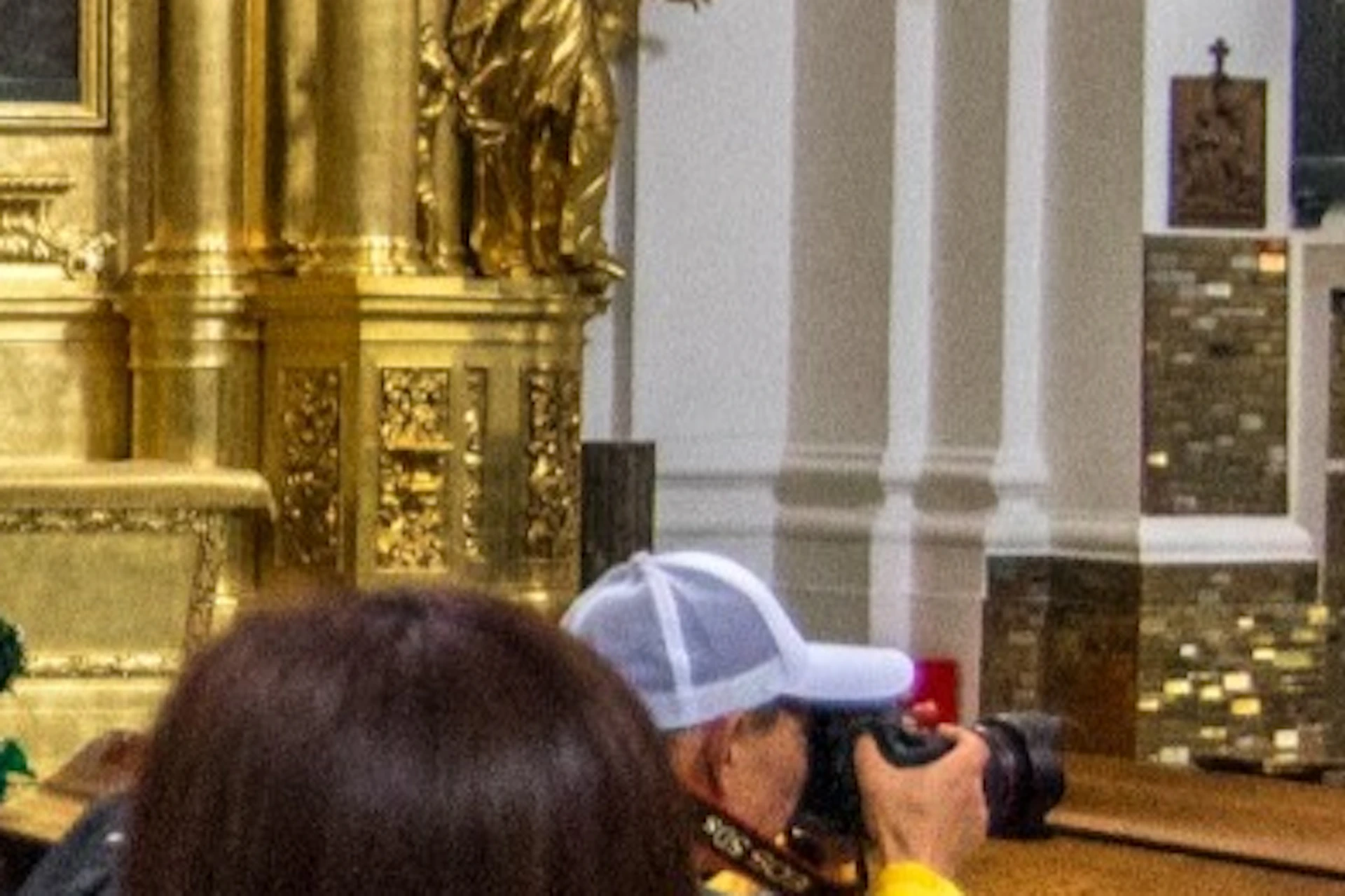 People viewing the plaque commemorating Chopin in the Holy Cross Church in Warsaw