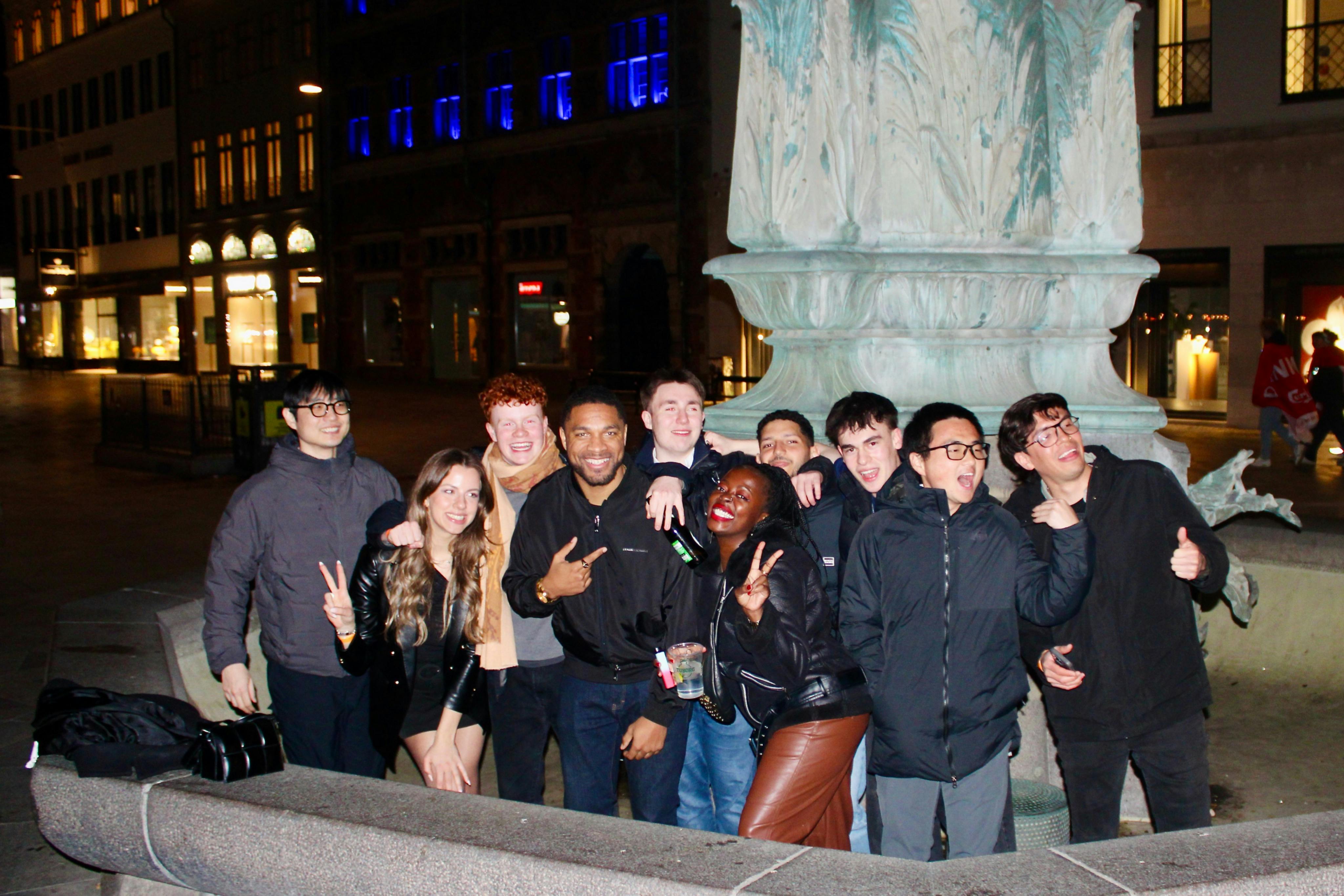 A small but crazy weekday pub crawl group in an (empty) fountain