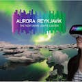 Northern lights over Icelandic landscape. Visitor enjoying the VR experience, world's first 360° aurora video