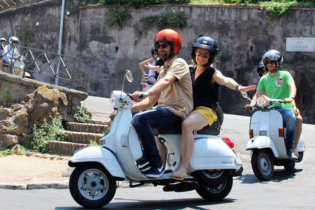 Riding a Vespa trough the hills around Florence