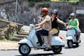 Riding a Vespa trough the hills around Florence