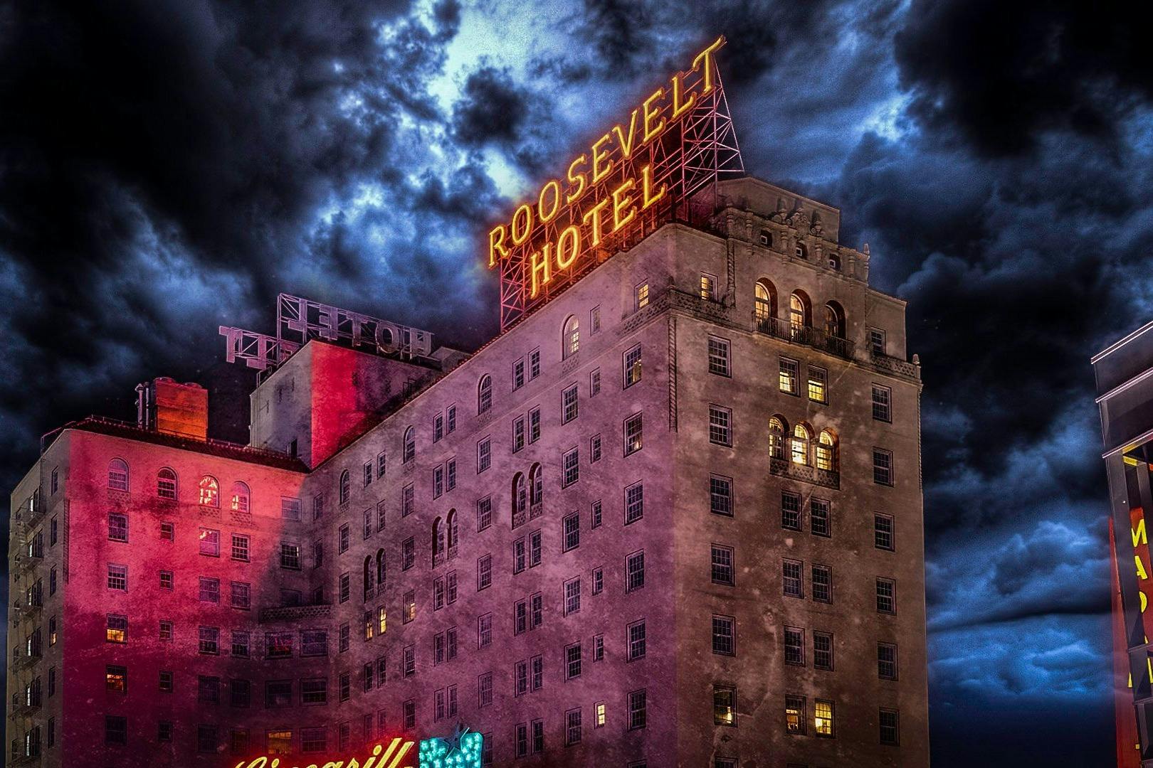 Nighttime photo of the Roosevelt Hotel in Los Angeles, with spooky clouds overhead
